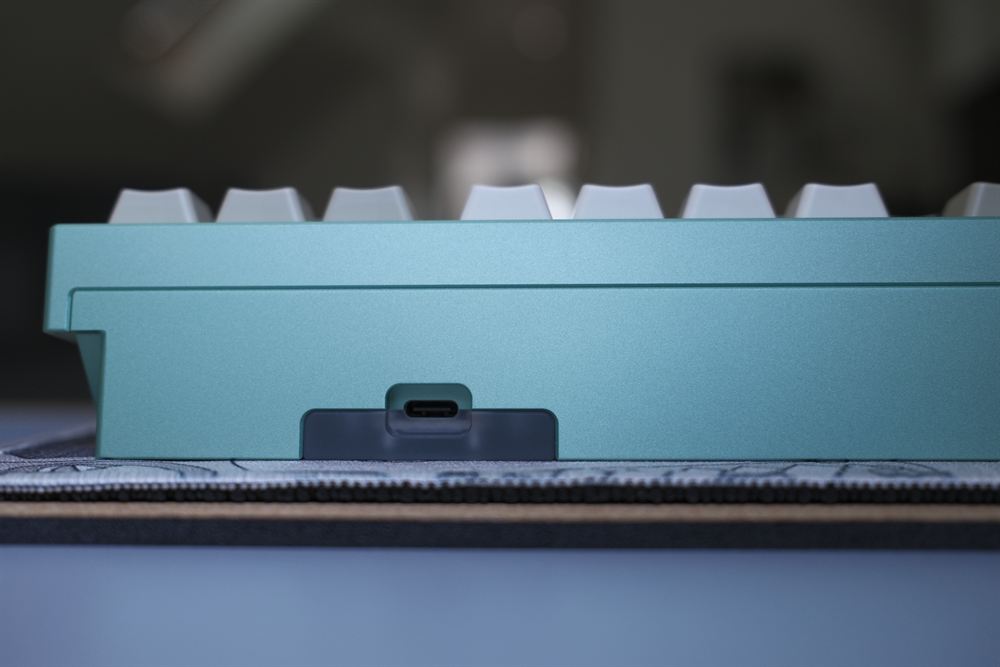 Rear side profile showing the USB-C port with background bokeh