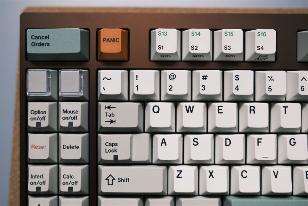Detail of the orange PANIC key and green-legended function row