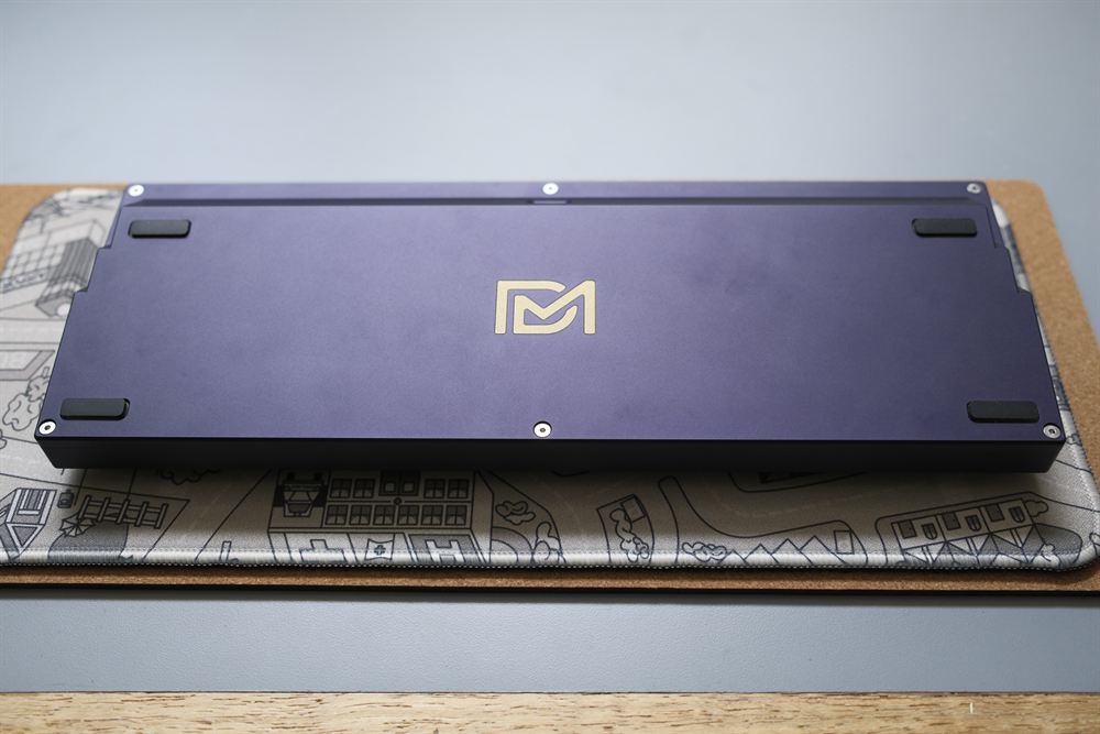 Underside of the case with the gold DM logo