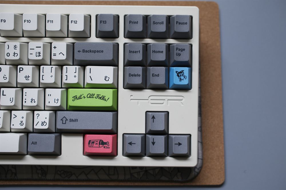 Right cluster with the green That's All Folks, pink and blue novelty keys and TGR logo