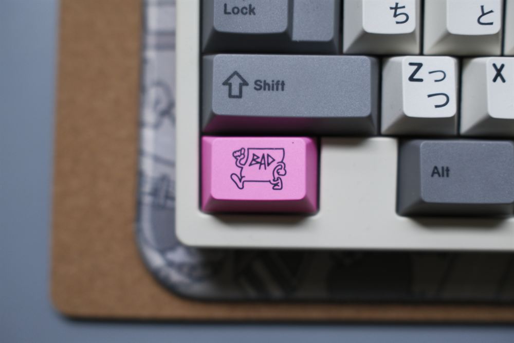 Macro of the pink BAD novelty keycap